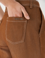 Brown high-waisted pants with turned up cuffs