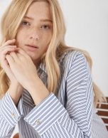 Blue and white striped loose blouse with long sleeves