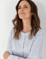 Blue and white striped shirt with belt loops on sleeves