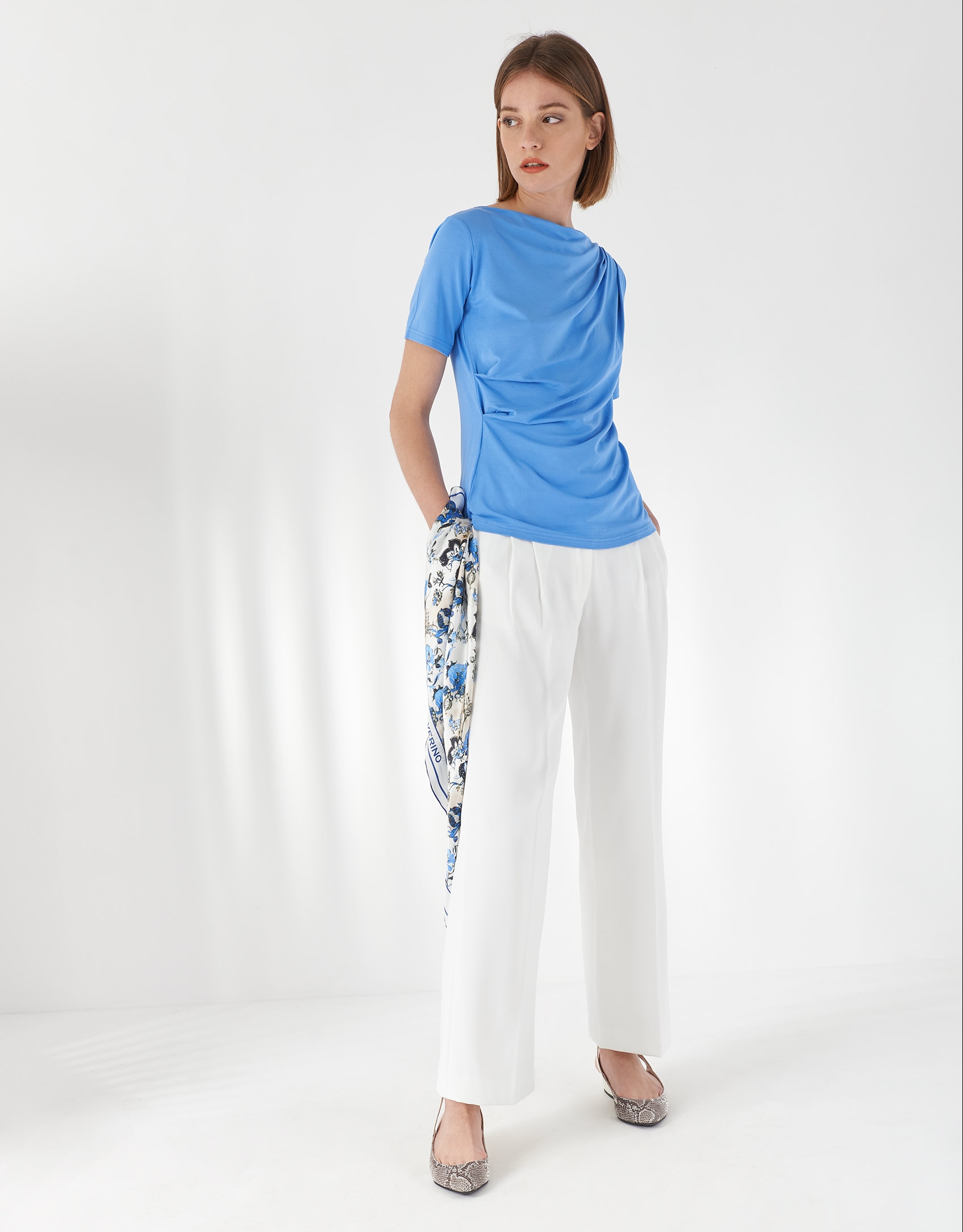 Blue top with draping at waist