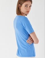 Blue top with draping at waist