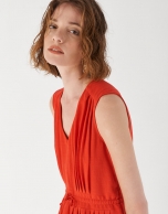 Red sleeveless dress with gathered V-neck