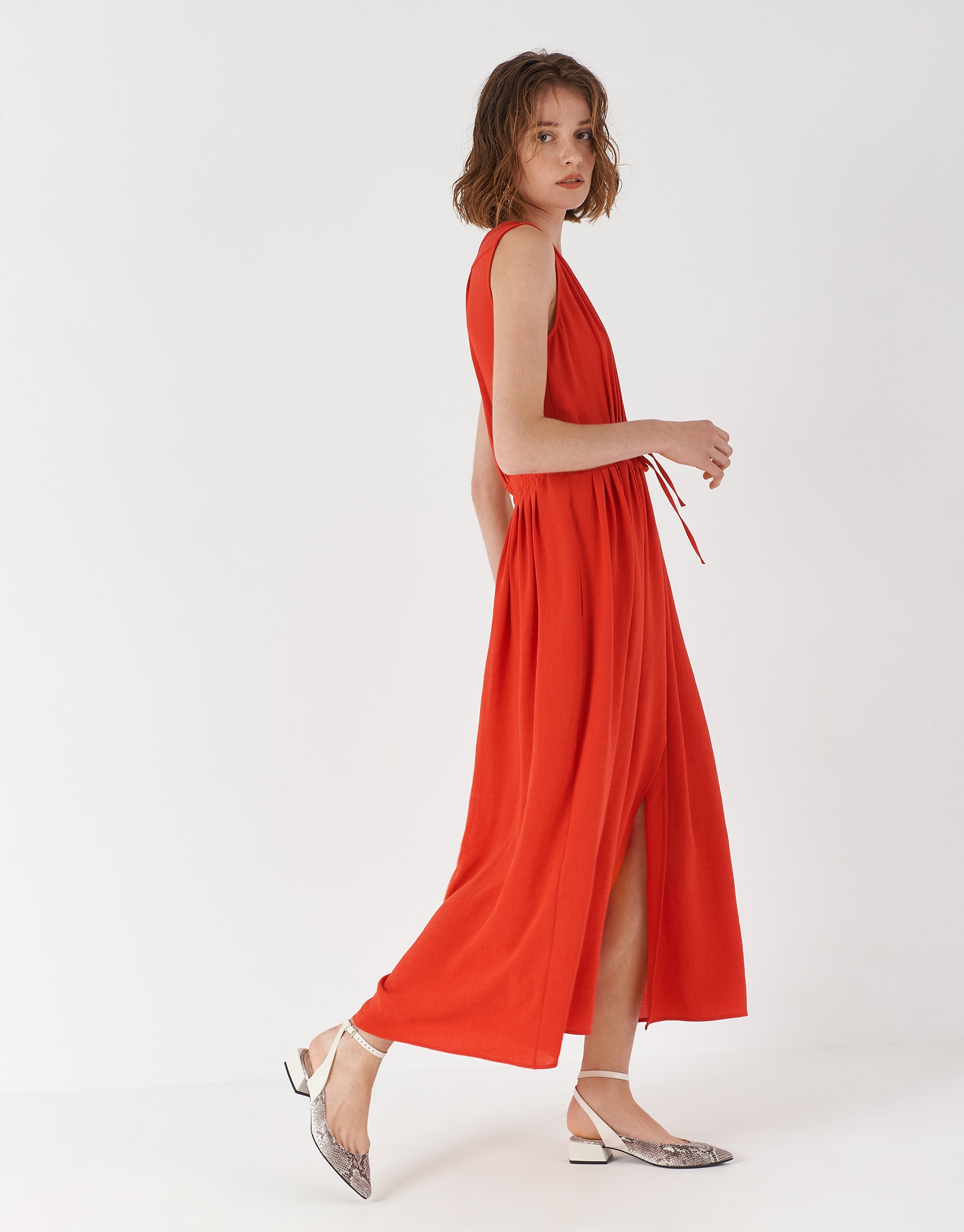 Red sleeveless dress with gathered V-neck