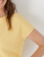 Yellow knit sweater with bat sleeves