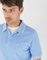 Blue pique cotton polo shirt with white outlines