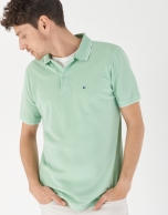 Green pique cotton polo shirt with white outlines