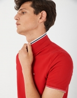 Red pique cotton polo shirt with white outlines