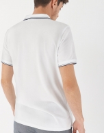 White pique cotton polo shirt with navy blue outlines