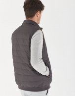 Gray and yellow brown reversible vest with down quilting 