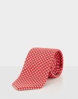 Red silk tie with  off white jacquard circle design