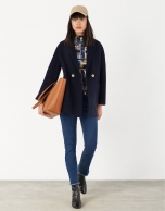 Short navy blue coat with double row of buttons