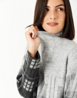 Gray and black checked knit sweater with high collar