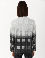 Gray and black checked knit sweater with high collar