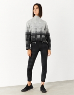 Gray and black checked knit sweater with high collar