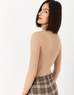 Sand-colored sweater with turned back collar and ribbing