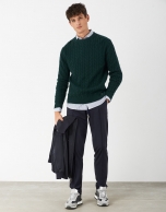 Green cable-stitched sweater