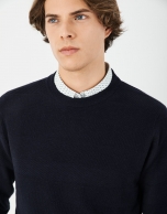 Navy blue sweater with embossed horizontal design