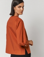 Orange blouse with V-neck and bow