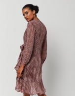 Long-sleeved draped dress with red and gold print