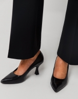 Black leather pumps