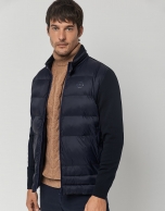 Navy blue quilted windbreaker with knit sleeves