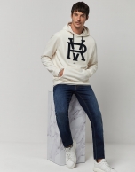 Beige felt sweatshirt with navy blue fuzzy RV logo 