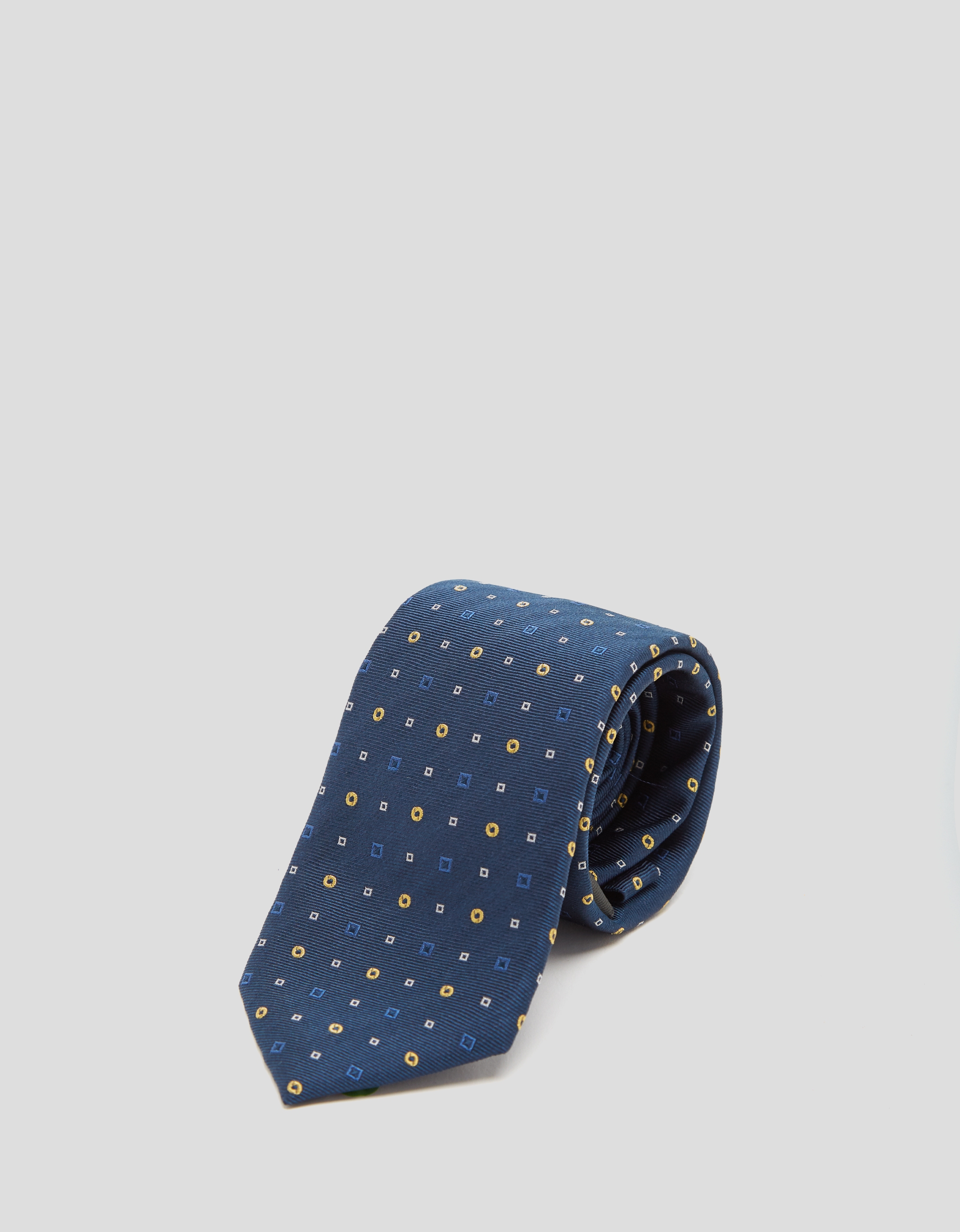 Blue silk tie with yellow geometric print jacquard