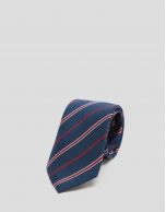 Navy blue silk tie with red and white stripes