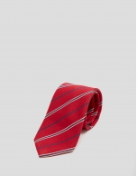 Red silk tie with navy blue and white stripes