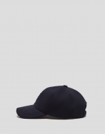 Navy blue felt baseball cap with embroidered design