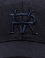 Navy blue felt baseball cap with embroidered design