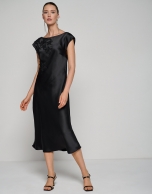 Black satin midi dress with embroidered stars