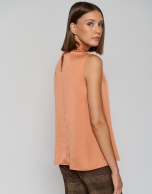 Orange satin knit top with bow