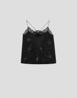 Black satin halter top with lace and stars