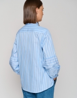 Blue striped blouse with puffed sleeves and a bow