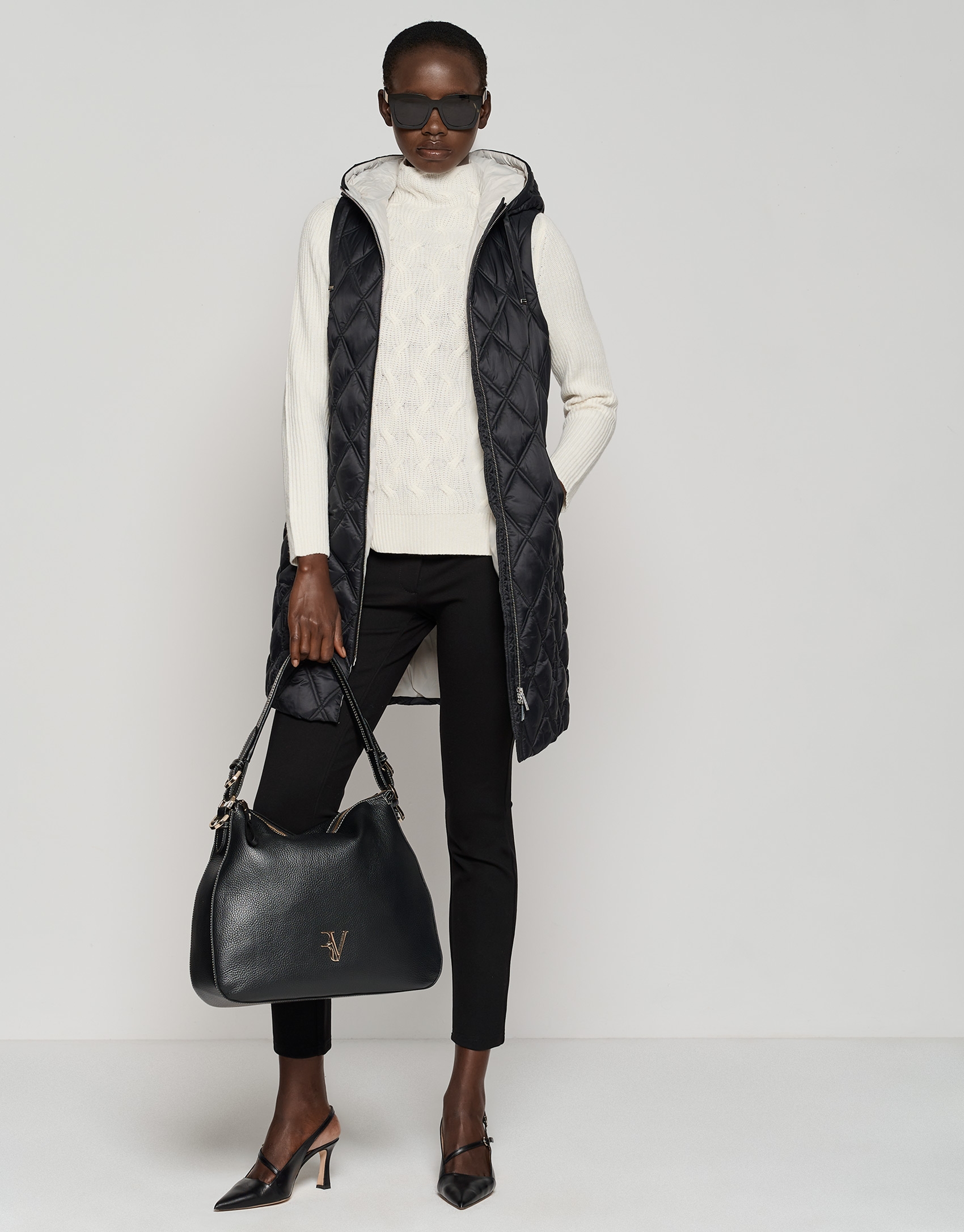 Long black quilted vest