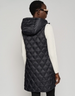 Long black quilted vest