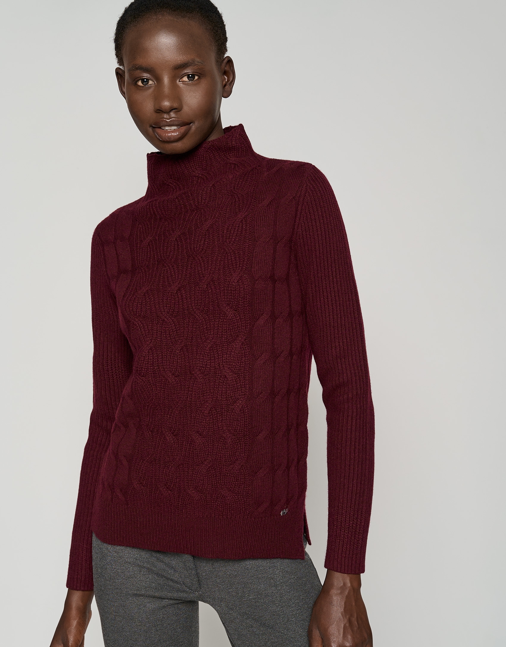 Burgundy sweater with cable stitching and ribbing