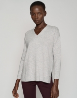 Long light gray sweater with V-neck