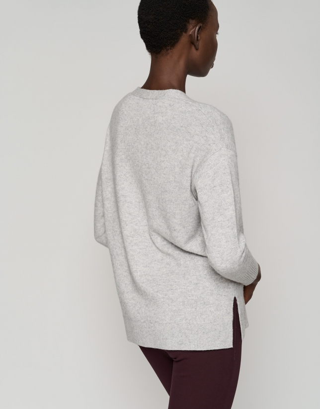 Long light gray sweater with V-neck