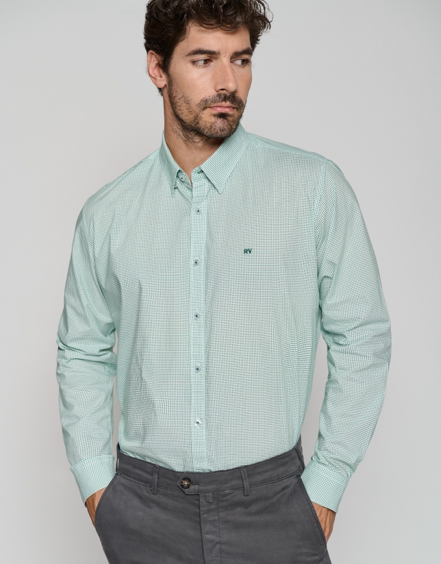 White regular sport shirt with green print