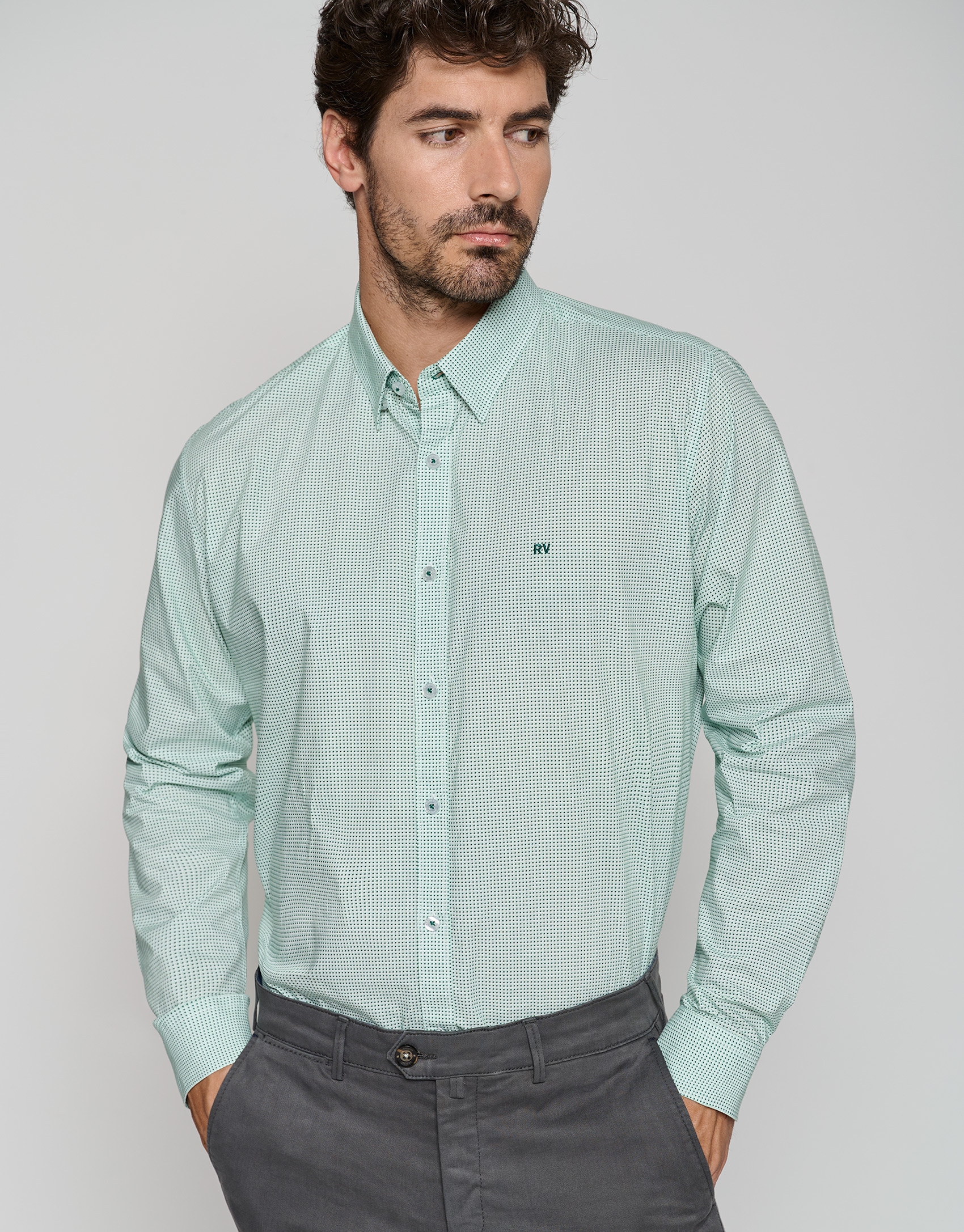 White regular sport shirt with green print