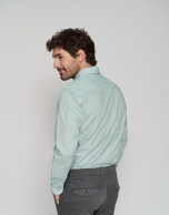 White regular sport shirt with green print