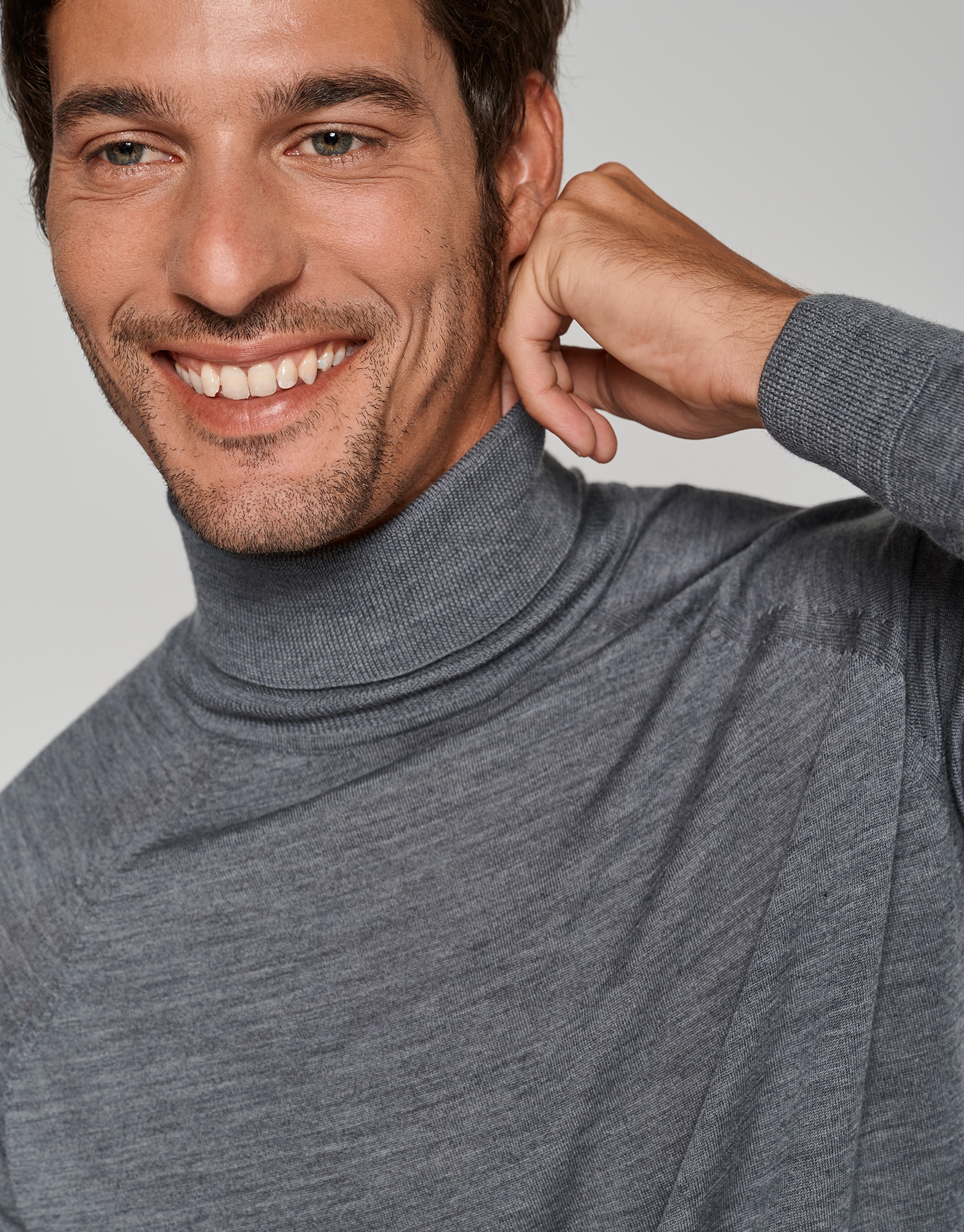 Gray melange wool sweater with a turtleneck collar