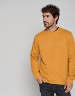 Sudadera amarilla oro logo firma