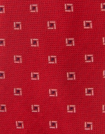 Red silk tie with navy blue and white geometric print jacquard