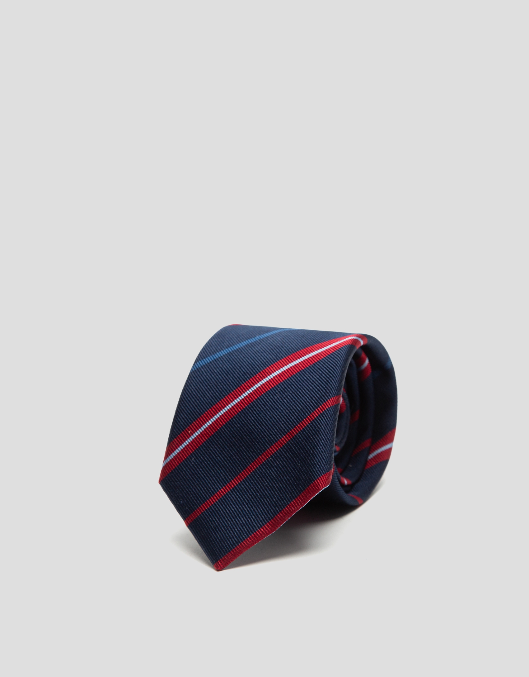 Navy blue silk tie with red and blue stripes