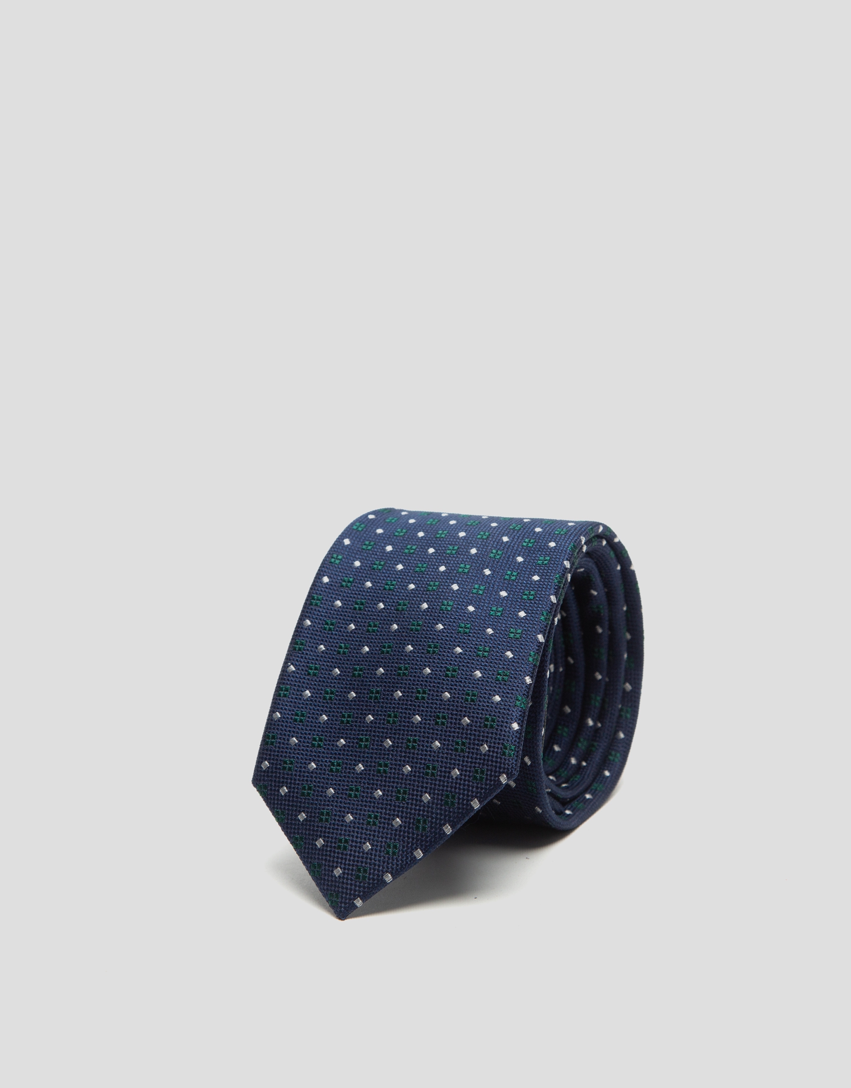 Navy blue silk tie with green and white geometric jacquard