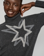 Dark gray sweater with raised collar and star