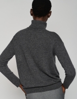 Dark gray sweater with raised collar and star